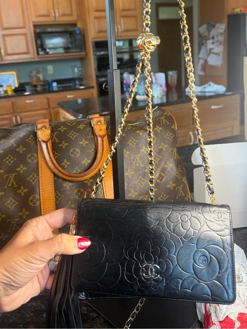 CHANEL Black Quilted Camellia Leather Crossbody with Gold Hardware & Tassel